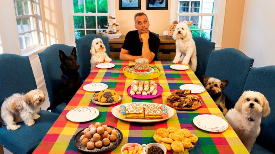 Joe Gatto dining with his six dogs