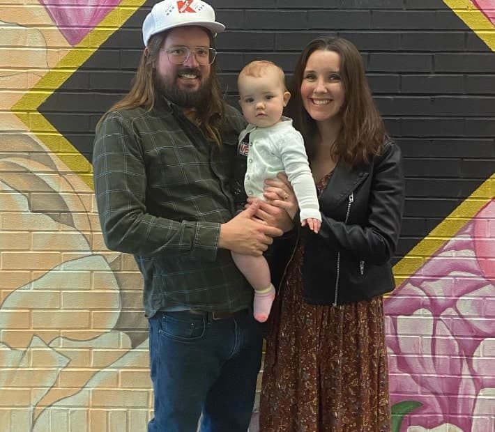 Image of Dusty Slay with his wife, Hannah Slay, and their daughter