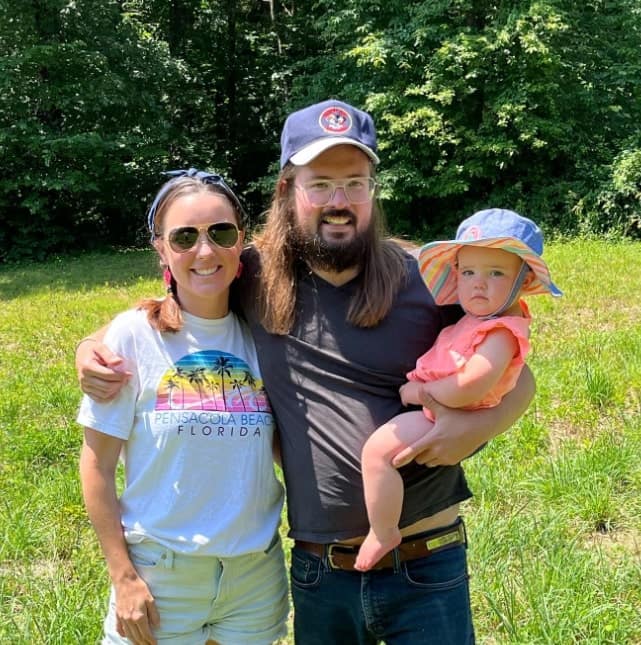 Image of Dusty Slay with his wife, Hannah Slay, and their daughter